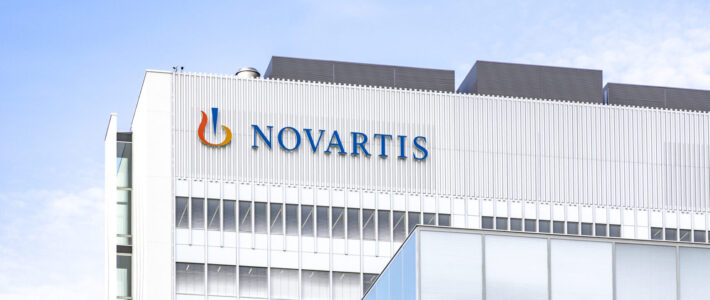 Logo of Novartis at a building in Basel