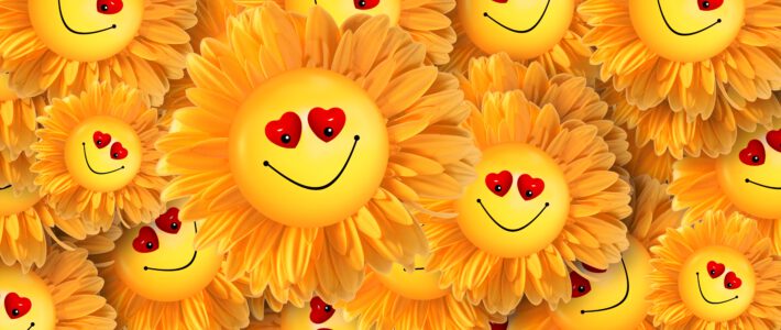 Viele Smileys aus Sonnenblumen und lachenden Gesichtern