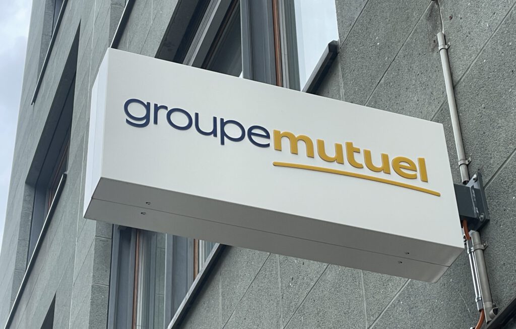 Ein Logo der Krankenkasse Groupe Mutuel