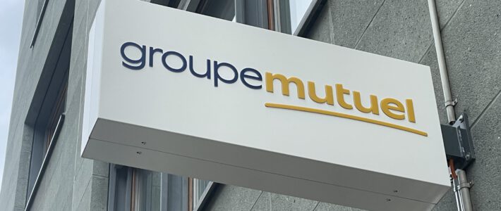 Ein Logo der Krankenkasse Groupe Mutuel