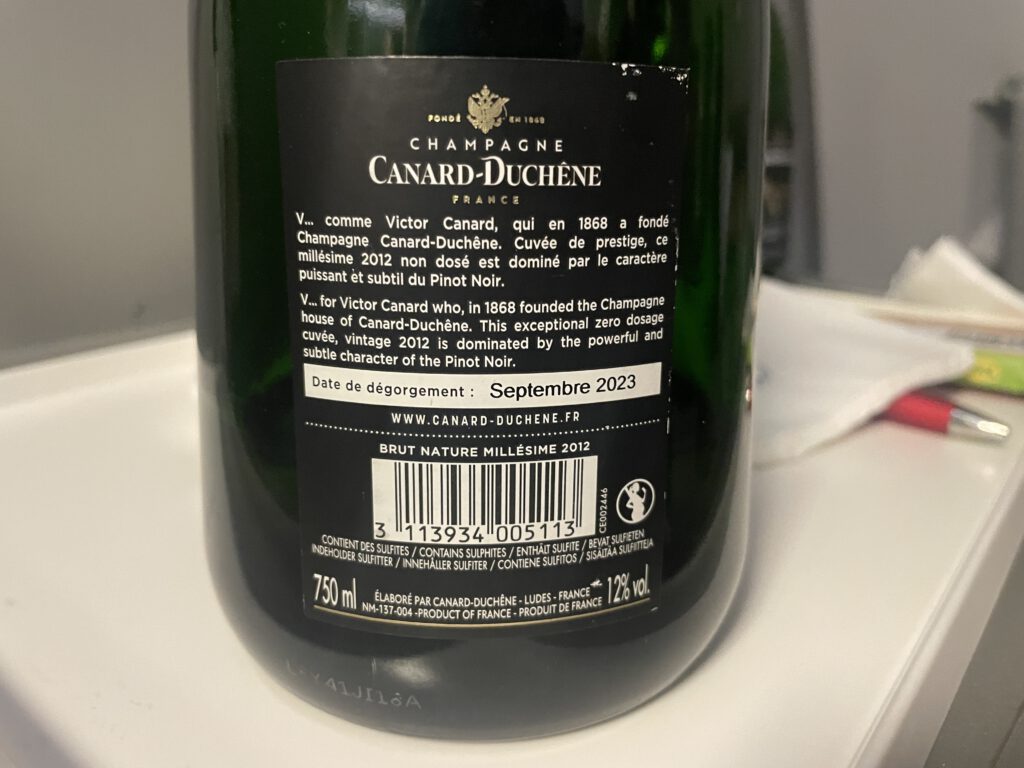 Rückseite einer Flasche Champagner von Canard-Duchene