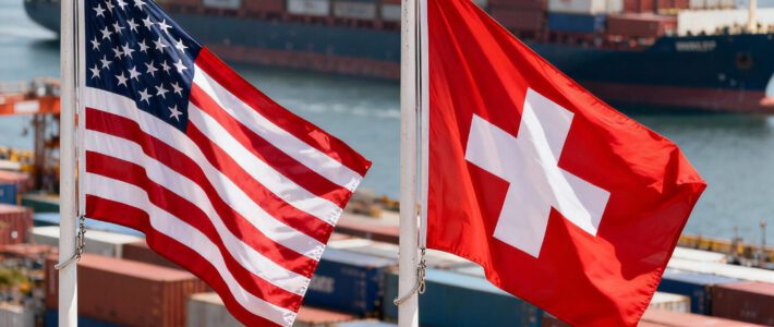 Flaggen der Schweiz und von den USA vor einem Containerhafen