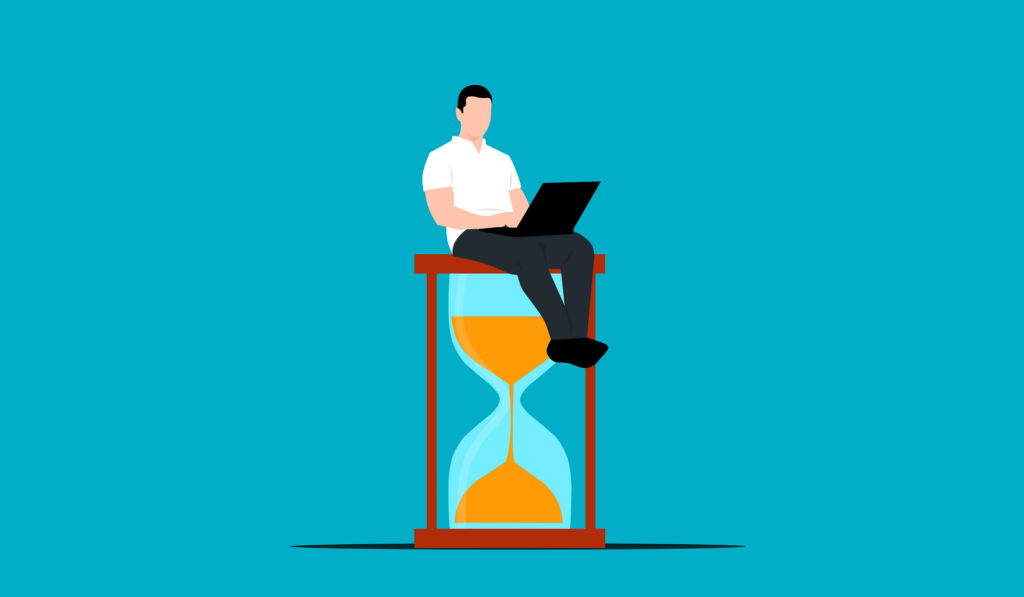 Ein Mann mit einem Computer auf einer Sanduhr