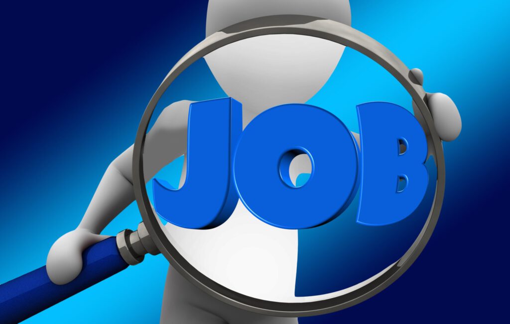 Eine schematische Person hält eine Lupe mit dem Wort JOB