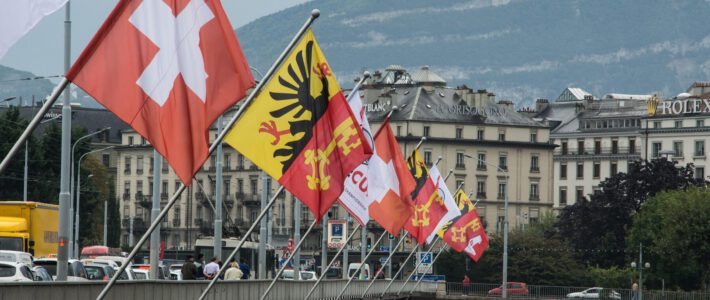 Unrecht in Genf beschert Bund hunderte Millionen zusätzlich Fahnen in Genf