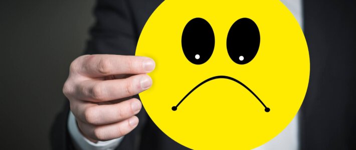 Konsumentenstimmung bricht stark ein Ein Smiley mit traurigem Gesicht