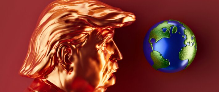 Ein Portrait von US-Präsident Donald Trump und eine Weltkugel in rotem Licht
