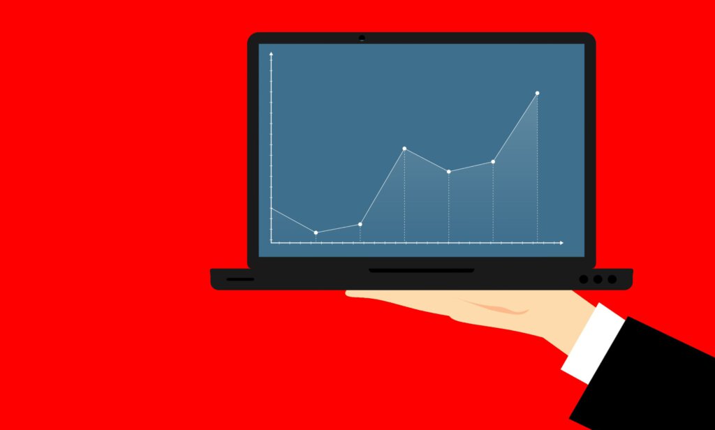 Eine Grafik präsentiert auf einem Notebook vor rotem Hintergrund